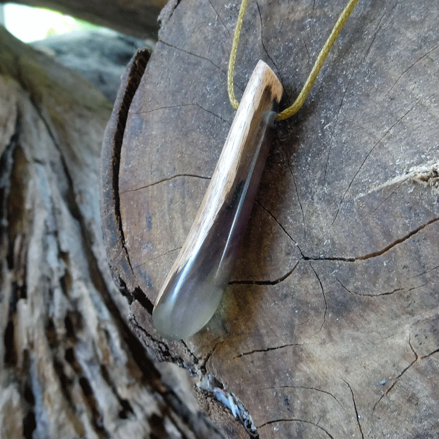 Driftwood with purple and green resin