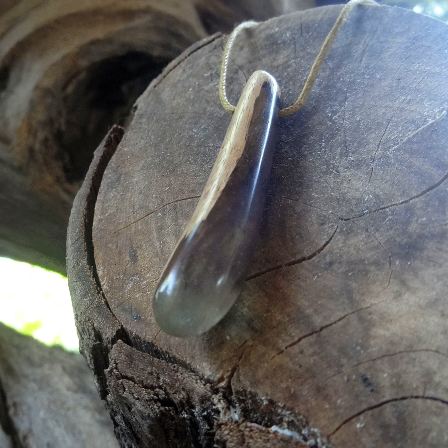 Driftwood with purple and green resin