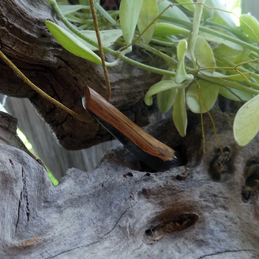 Driftwood with purple and green resin