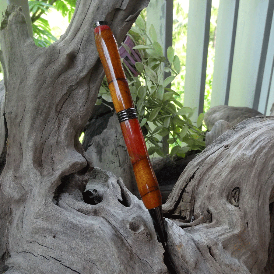 Driftwood and red, yellow and purple resin pen