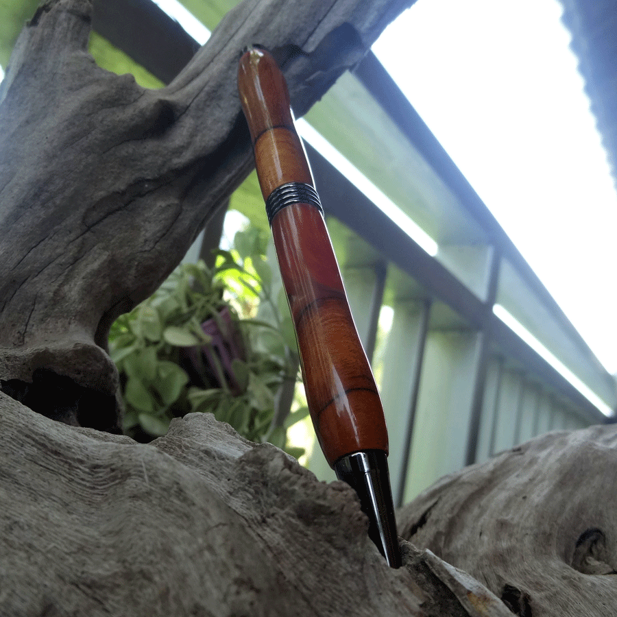 Driftwood and red, yellow and purple resin pen