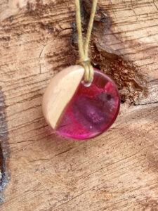 Driftwood with pink resin and purple heart