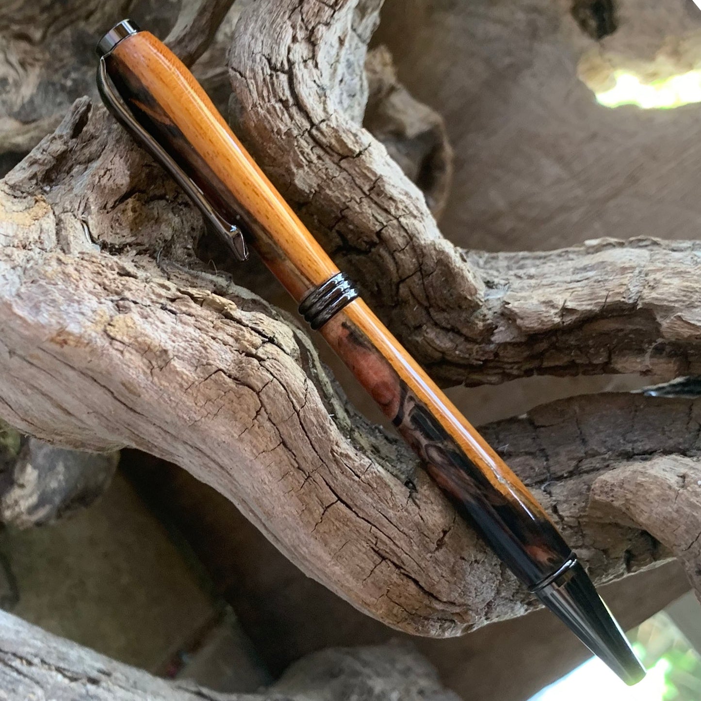 Driftwood and black and red resin pen