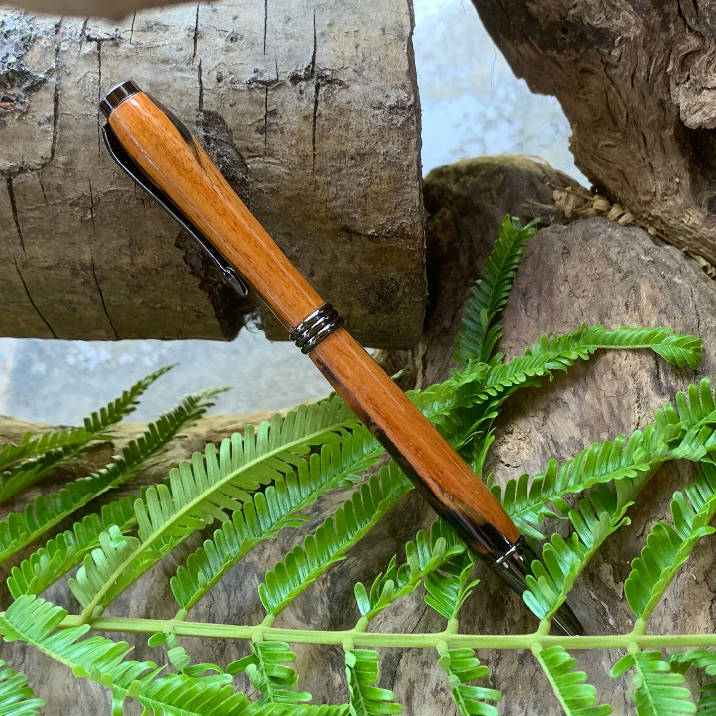 Driftwood and black and red resin pen