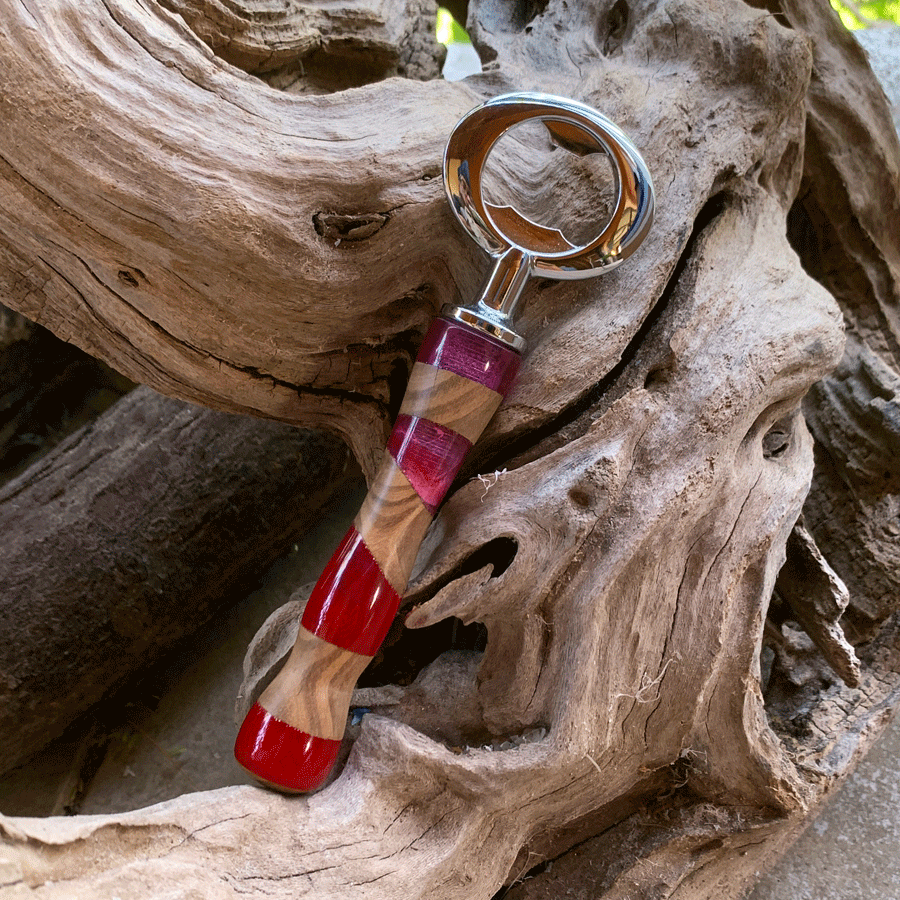 Driftwood and pink and red resin bottle opener