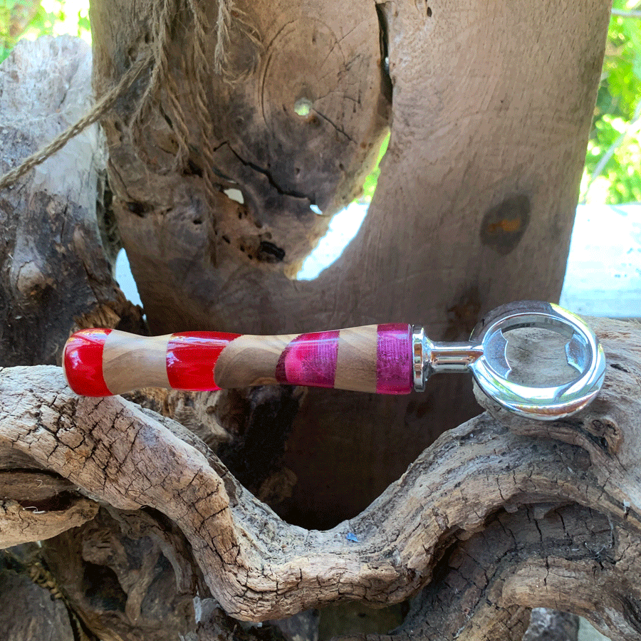 Driftwood and pink and red resin bottle opener