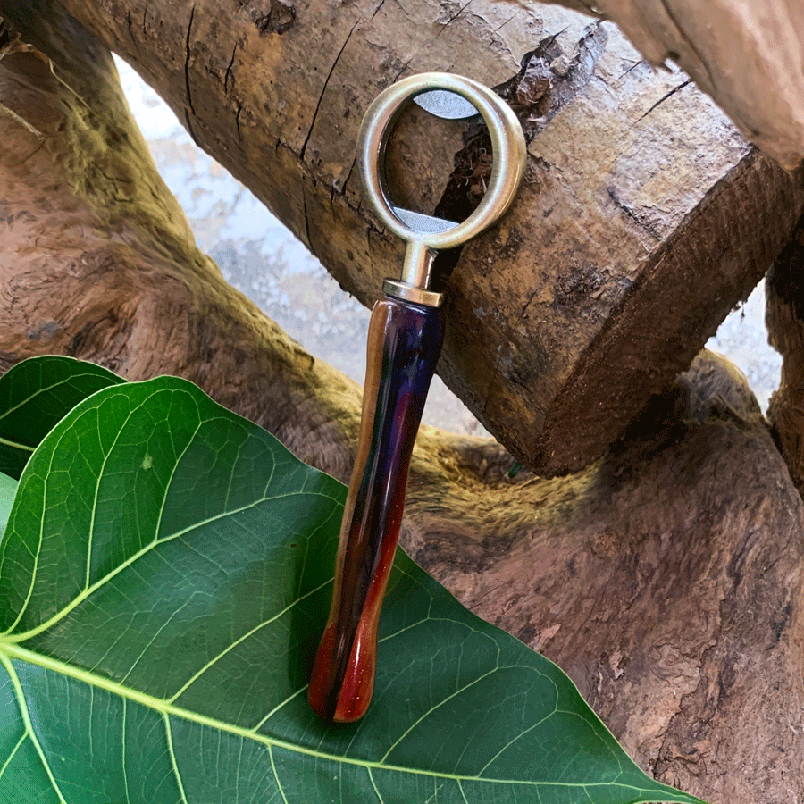 Driftwood and rainbow coloured resin bottle opener