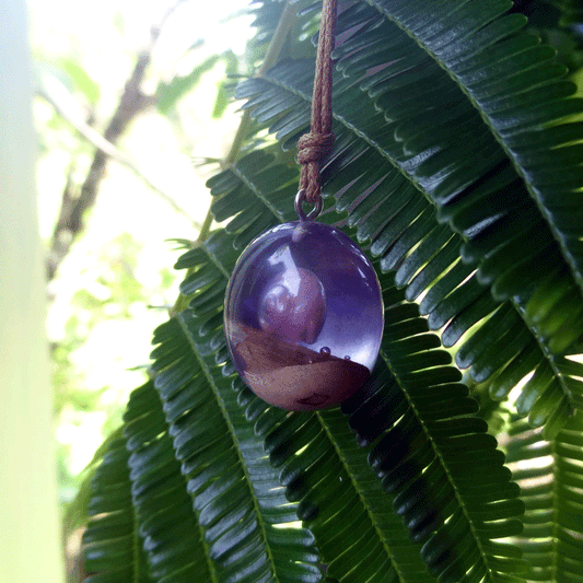 Driftwood with light purple resin and shell